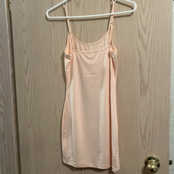Love McNicoll pretty pastel coloured dress with a peach long camisole underneath - Picture 4 of 7